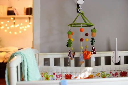Ð¡ozy baby bed in the bedroom. Cozy white crib. Interior of kids room.の写真素材