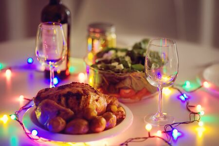 Toned photo of romantic supper for pair in New year eve. Homemade organic food.の写真素材