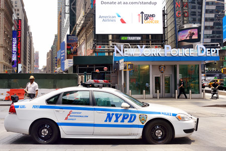 NEW YORK, USA - July 10, 2019: NYPD car on background of New York Police Department on downtown of Manhattan at summer day.のeditorial素材