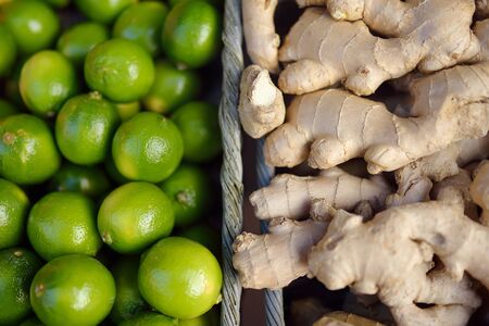 Fresh healthy bio citrus in Monaco supermarket - limes and ginger roots. Organic vegan food....