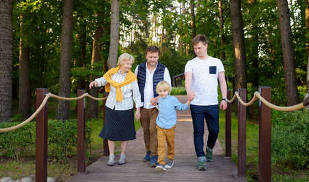 Big family of senior woman and her adult son with his two sons. Grandmother and grandchildrens....