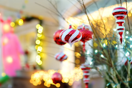Bush or tree decorated red Christmas balls. Detail of courtyard decorated for winter holidays - Christmas and New Year. Magical vibe on Xmas eve in NYC.の写真素材