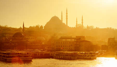 Stunning sunset view of the Golden Horn bay in Istanbul, Turkey. Suleymaniye mosque and New mosque in Sultanahmet district. Travel, tourism and sightseeing spots in Turkey.の写真素材