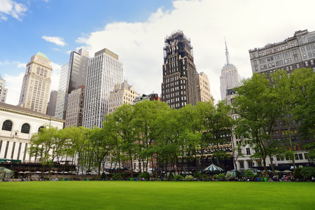 New York, USA - May 11, 2021: People are relaxing and enjoying nice sunny spring day in Bryant Park...