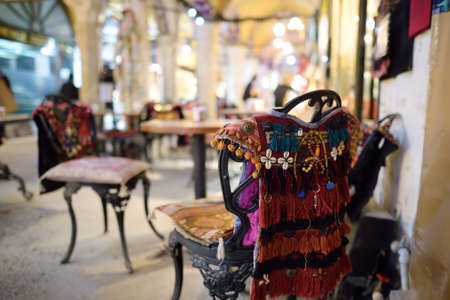 Decorated chairs and a table in a small cafe at the Grand Bazaar market in Istanbul, Turkey....