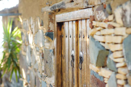 Detail of the entrance door of ancient houses in Phicardou (Fikardou) village, Cyprus. This beautiful village declared Ancient Monument. A tiny abandoned village in the Troodos Mountainsの写真素材