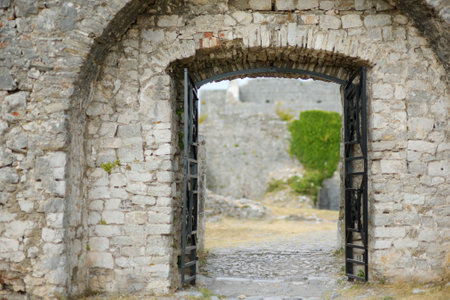 View of the famous Rozafa fortress near the city of Shkodra. Gates of the bastion lead through an ancient stone wall. The fort attracts visitors from all over the world. Travel and tourism in Balkanのeditorial素材