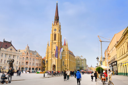 Novi Sad, Serbia - April 8, 2023: View of famous Roman Catholic Cathedral of the Virgin Mary at the Central square of the city in Novi Sad, Serbia.のeditorial素材