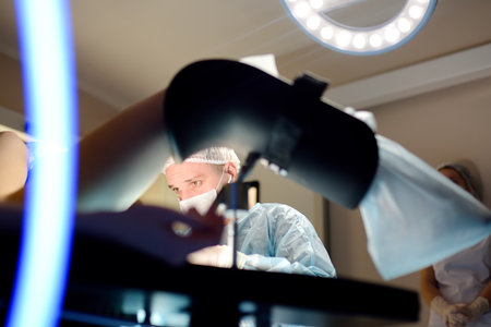 Gynecologist operation patient in gynecological chair. Doctor performs an invasive medical procedure...