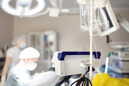 Gynecologist operation patient in gynecological chair. Doctor performs an invasive medical procedure...