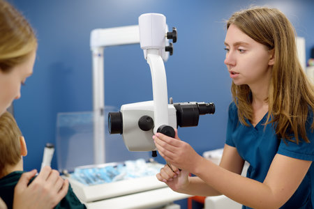 A cute toddler boy with his mother are at an appointment with a pediatrician ENT. The doctor...