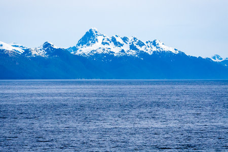 Snow-capped mountains along the coast of southern Alaska
