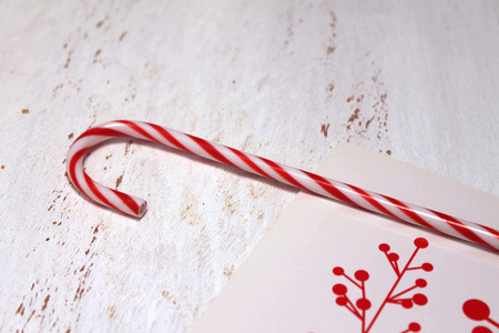 Candy cane and a Christmas cardの写真素材
