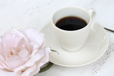 Romantic breakfast with a cup of coffee and a flowerの写真素材