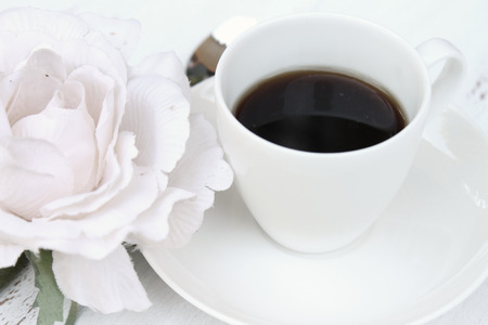 Romantic breakfast with a cup of coffee and a flowerの写真素材