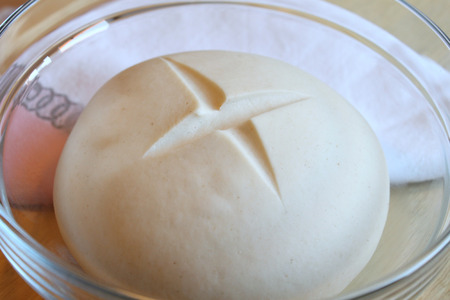 Sourdough starter in large glass jar on the tableの写真素材