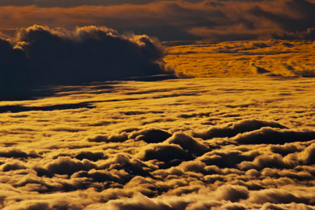 Cloudscape, Colored Clouds at Sunset near the Ocean Viewed from an Airplane