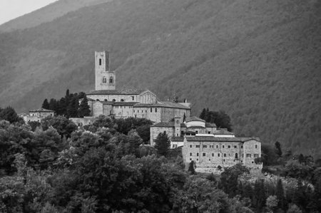 Black and white photo of medieval town in the heart of Italy among the mountains