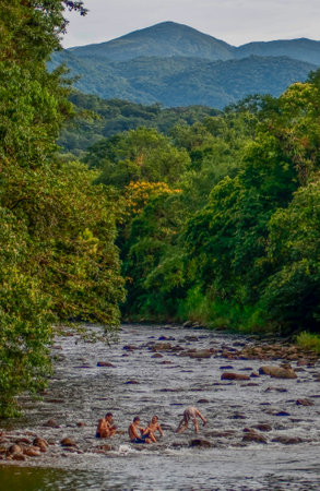 Mountain river in the middle of the forest with a group of people swimming. Nhundiaquara River ParanÃ¡, Brazilの写真素材