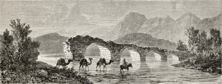 Old illustration of Camels fording a river near Turgutlu (once Cassaba) at the foot of Mount Sypilus. Created by Gaiaud, published on Le Tour du Monde, Paris, 1864のeditorial素材
