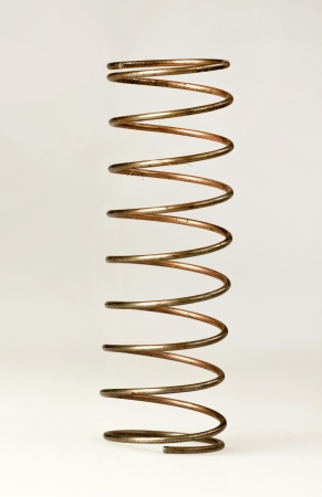 Brass spring on white backgroundの写真素材
