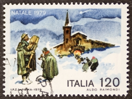 ITALY  CIRCA 1979: a stamp printed in Italy celebrates Christmas showing bagpiper near a church. Italy, circa 1979のeditorial素材