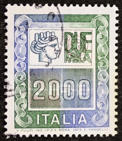 ITALY  CIRCA 1979: a stamp printed in Italy shows Italia Turrita and the indication of an high monetary value. Italy, circa 1979のeditorial素材