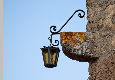 Old lantern on a wall cornerの写真素材