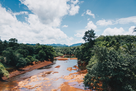 Landscape of blue sky and white cloud over the mountain river and forest, Travel location as Suratthani in Thailandの写真素材