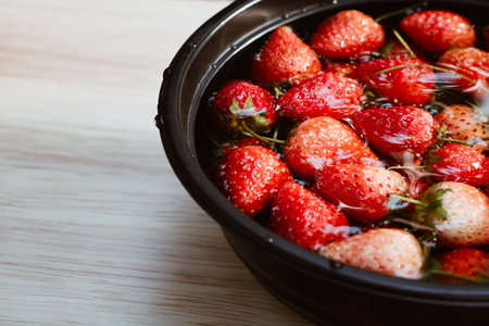 Fresh strawberry in bowl closeupの写真素材