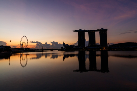 SINGAPORE - APRIL 15, 2017 : Cityscape in dawn time of Marina Bay Sands Hotel in Singapore, Marina bay, Singapore flyer, Art Science Museum are famous landmarks of tourist in Singapore.のeditorial素材