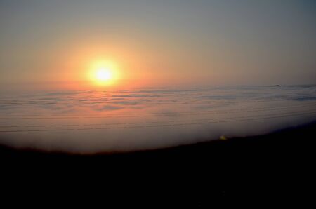 sunset in the sky with cloudsの写真素材