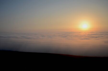 sunset in the sky with cloudsの写真素材