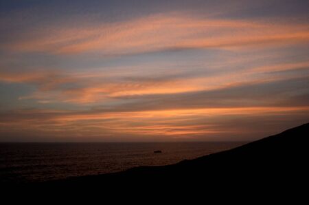 sunset in the sky with cloudsの写真素材