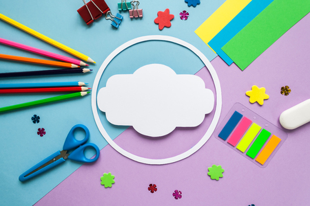 Back to school, round frame with stationery on blue and violet background. flat lay.の写真素材