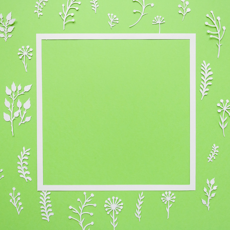 square frame, summer meadow cut of white paper on green background. Plants and leavesの写真素材