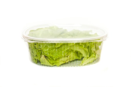fresh salad in plastic container isolated on white background. mock upの写真素材