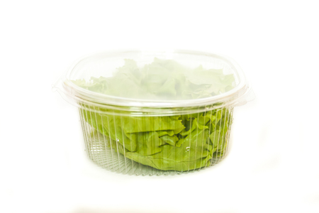 fresh salad in plastic container isolated on white background. mock upの写真素材