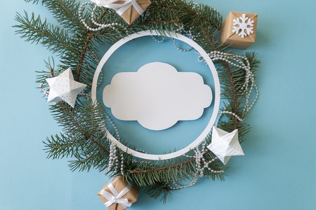 Merry Christmas and Happy new year. Round frame with branches firtree, gifts, pine cones