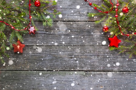 Merry Christmas and Happy New Year. Christmas Decorative Ornate Fir Glitter Natural Gifts on wooden Background. red Holiday Concept.の写真素材