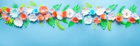 Border to March 8 Women's Day, Valentine day. Greeting card with paper flowers on blue background. Cut from paper.の写真素材