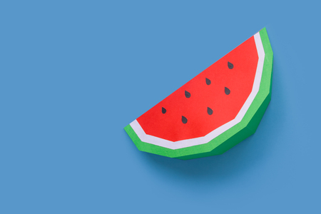 Watermelons made of paper on blue pastel background. Creative concept.の写真素材