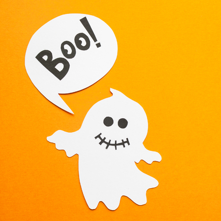 Happy Halloween. Halloween black and white decor made of paper on orange background.の写真素材