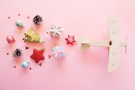 wooden childrens plane on a pink backgroundの写真素材