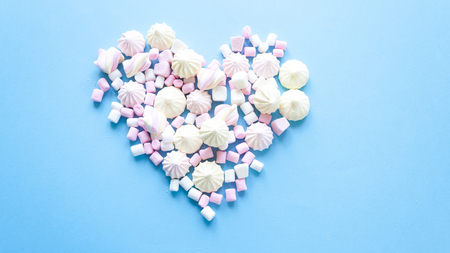 various pastel marshmallows on a blue backgroundの写真素材