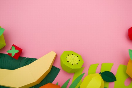 different exotic fruits made of paper on pink background