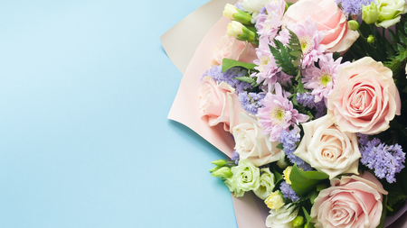 Bouquet, Flower background, different roses, chrysanthemum lisianthus on blue backgroundの写真素材