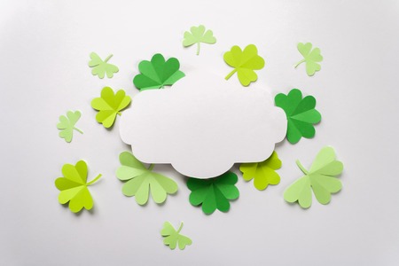 Happy St.Patrick's Day, freme with shamrock cut from paper on white background, text greeting card rasterの写真素材