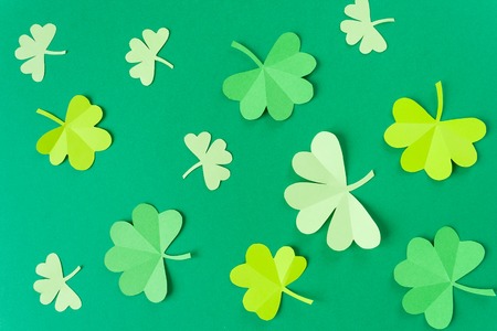 Happy St.Patrick's Day, pattern of shamrock cut from paper on green background, text greeting card rasterの写真素材