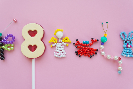 children's crafts and sweet 8 figure on a pink background. Children's creativity, handmade